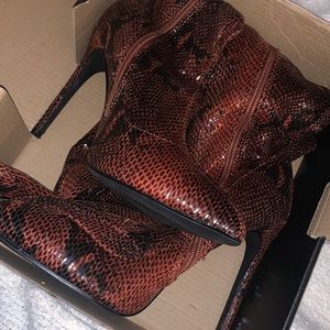 Snake skin high boots